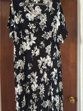 Woman Within Black Dress with White Floral Pattern